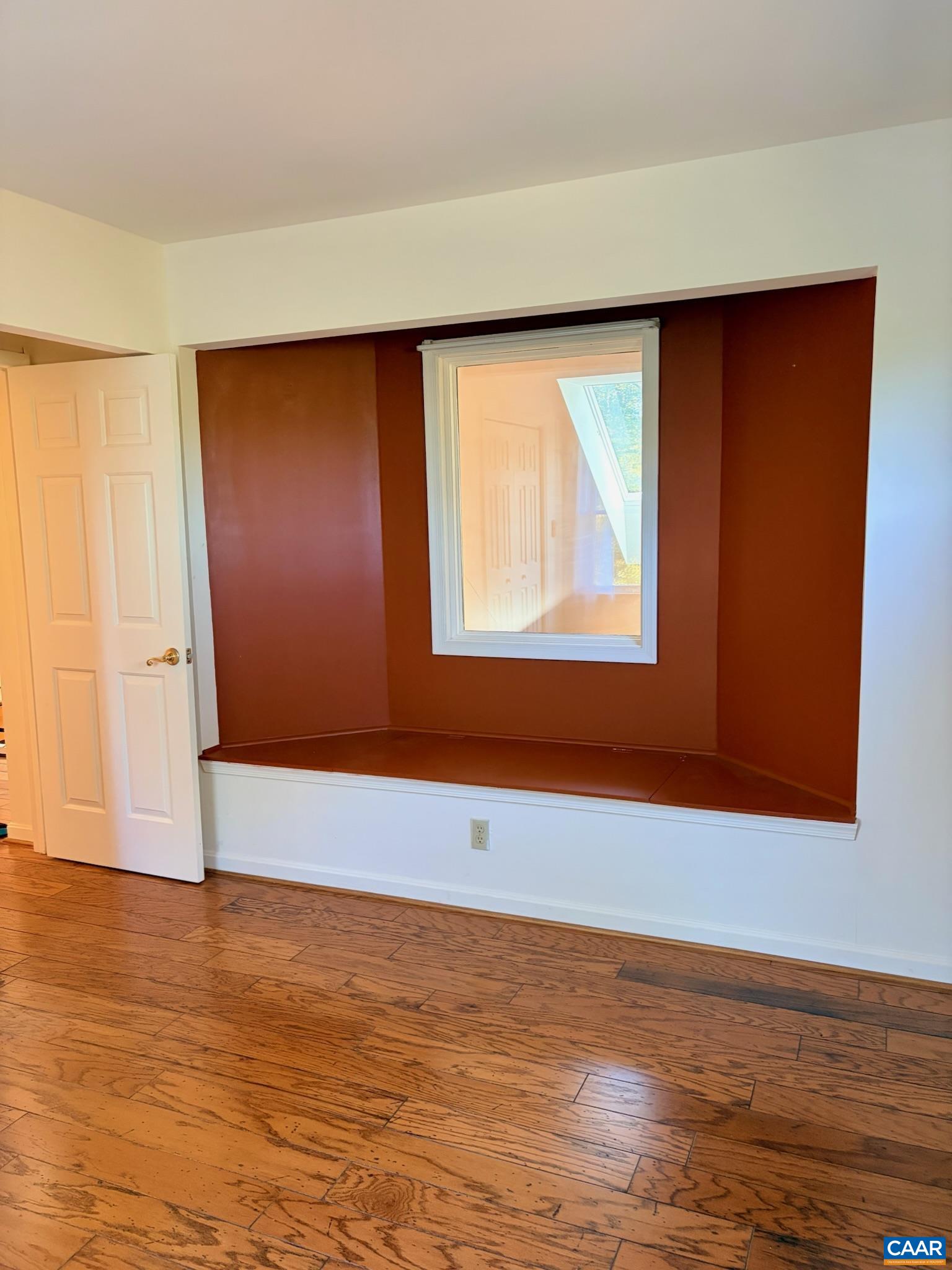 699 Winton Road Amherst, VA 24521 - Photo 25 of 35 a view of an empty room with wooden floor and a window