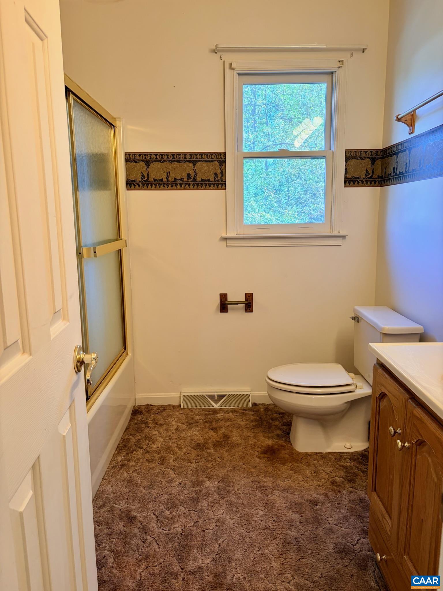 699 Winton Road Amherst, VA 24521 - Photo 27 of 35 a bathroom with a toilet a sink and a window