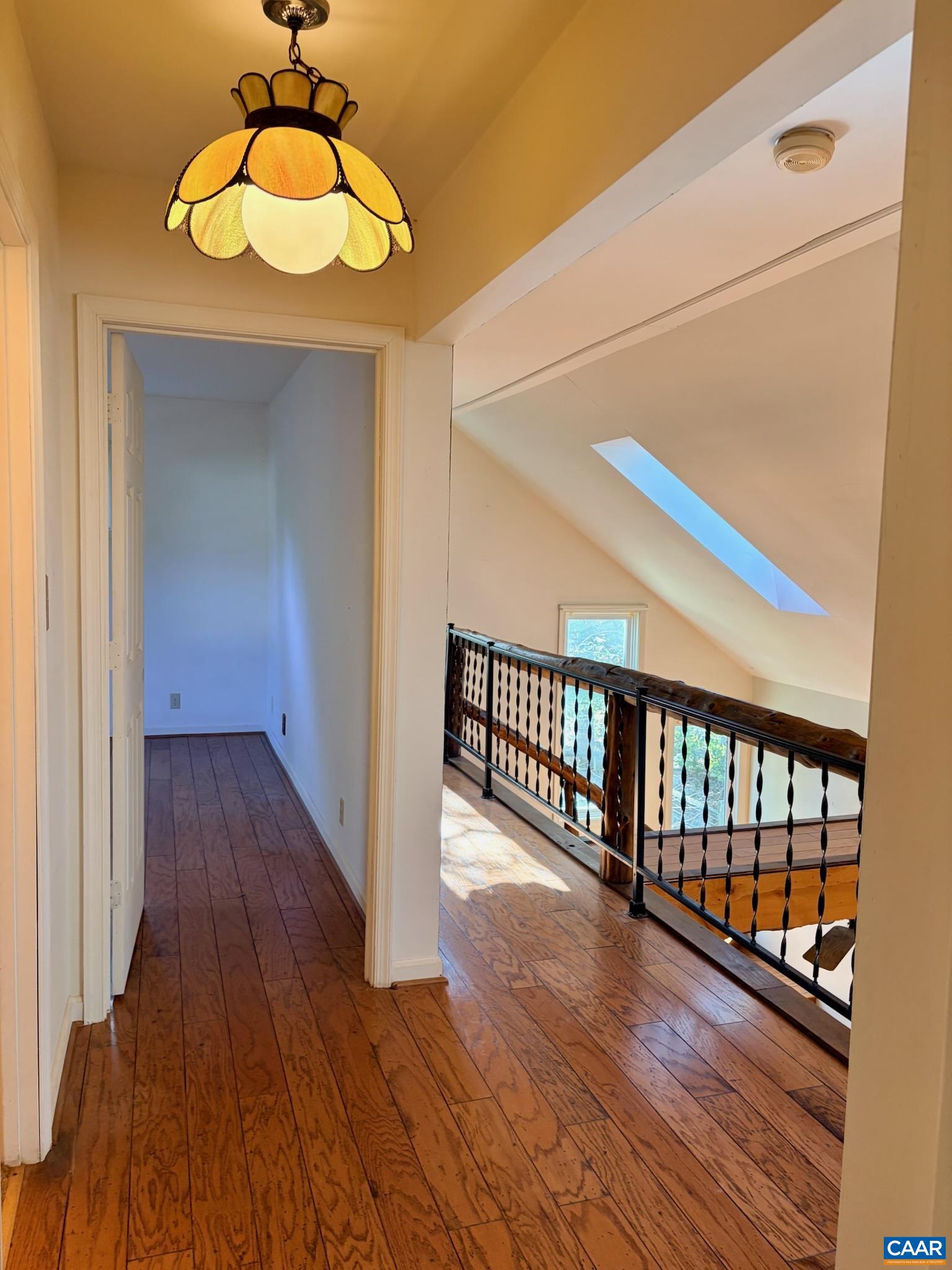 699 Winton Road Amherst, VA 24521 - Photo 28 of 35 a view of a hallway with wooden floor and chandelier