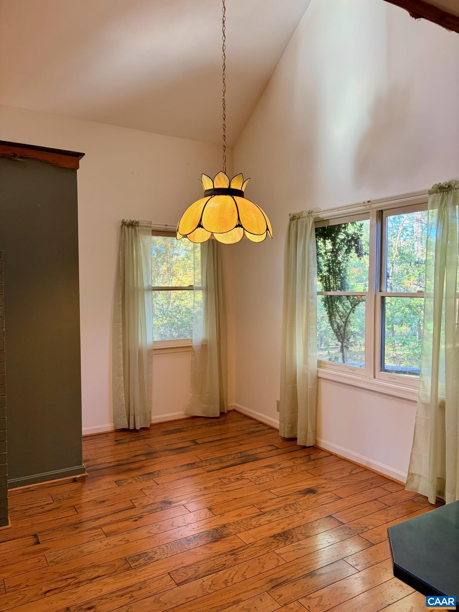 699 Winton Road Amherst, VA 24521 - Photo 5 of 35 an empty room with wooden floor and windows