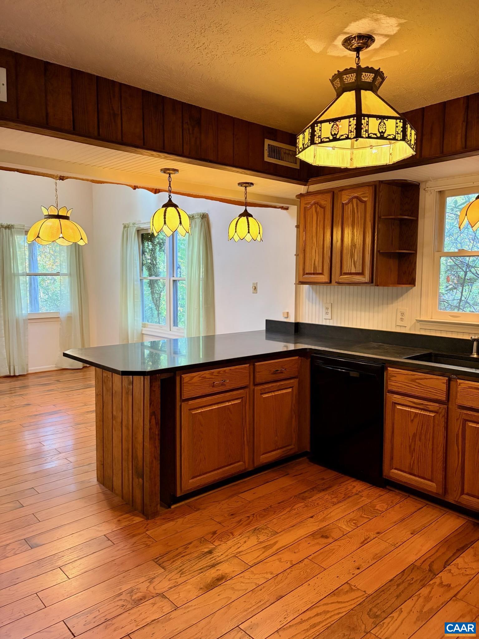 699 Winton Road Amherst, VA 24521 - Photo 7 of 35 a kitchen with stainless steel appliances granite countertop a sink and a wooden cabinets