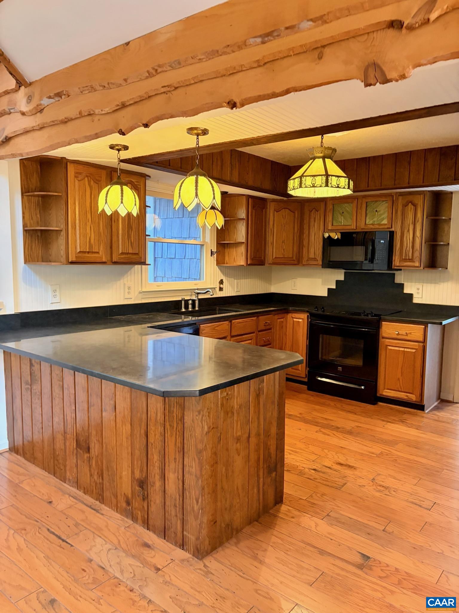 699 Winton Road Amherst, VA 24521 - Photo 8 of 35 a kitchen with stainless steel appliances kitchen island granite countertop a sink and cabinets