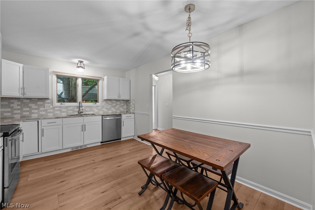 73 Lethbridge Lane Akron, OH 44321 - Photo 13 of 44 granite counters, chic, over-the-table lighting...