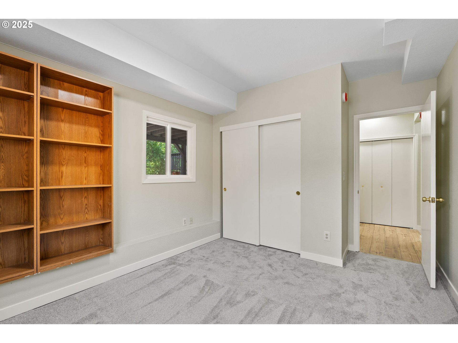 1472 Southwest 14th Street Gresham, OR 97080 - Photo 19 of 32 a view of an empty room with wooden floor and closet