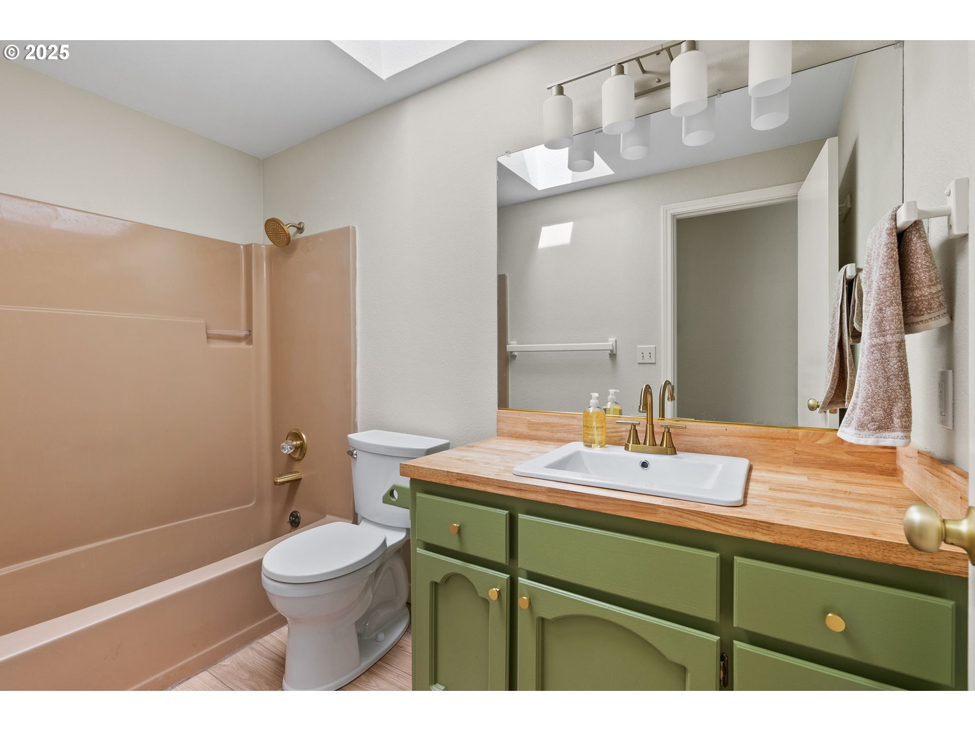 1472 Southwest 14th Street Gresham, OR 97080 - Photo 9 of 32 a bathroom with a sink a toilet and shower
