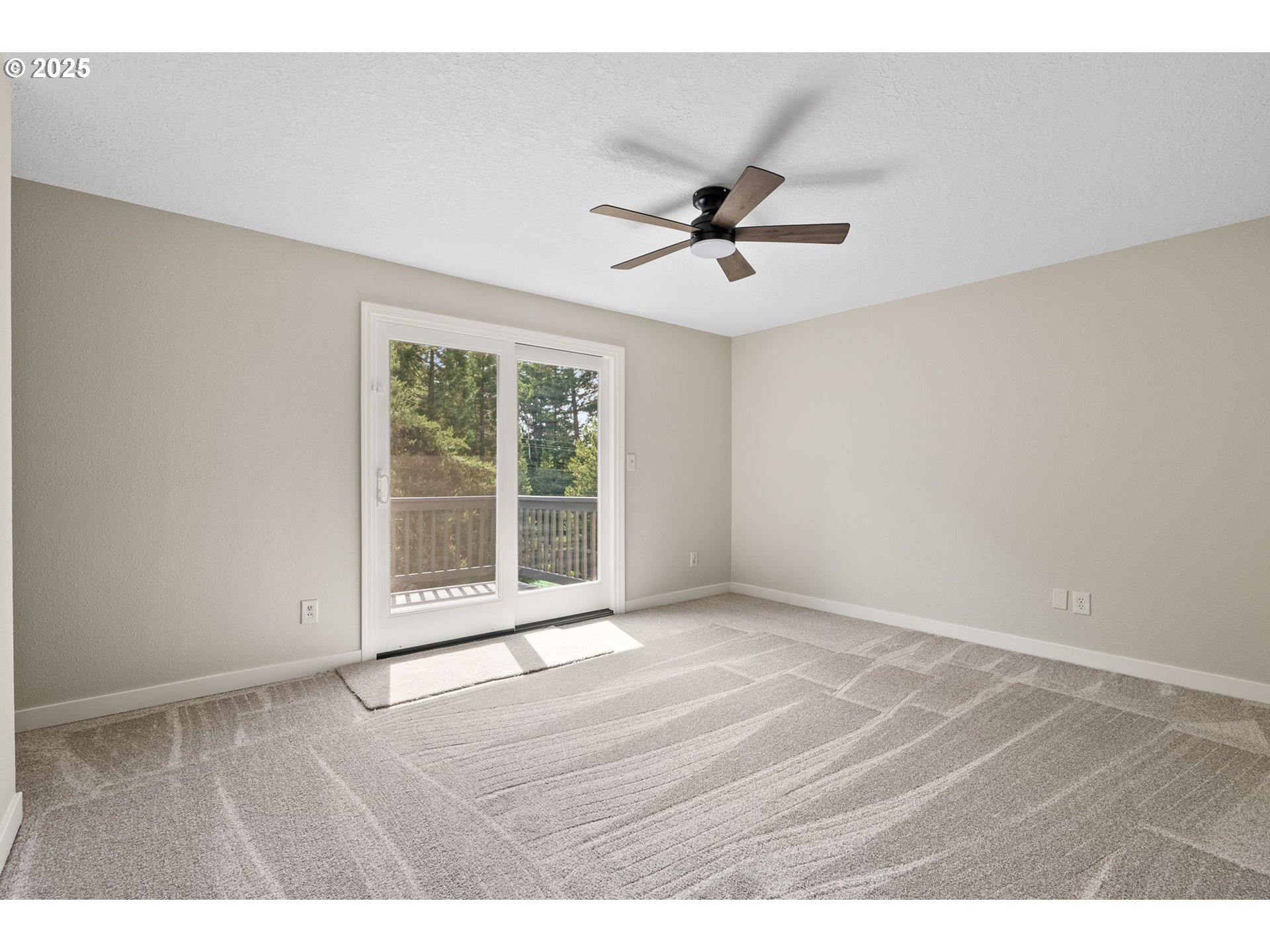 1472 Southwest 14th Street Gresham, OR 97080 - Photo 10 of 32 a view of an empty room with a window and wooden floor