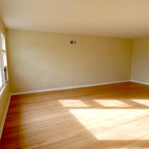 a view of room and wooden floor