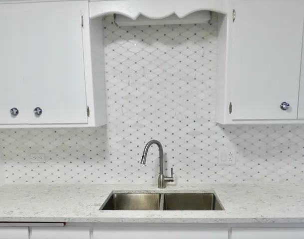 a close view of a sink and a mirror