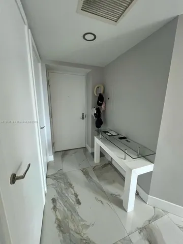 a living room with furniture and a gate