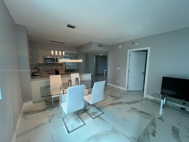 a bedroom with a bed and a lamp