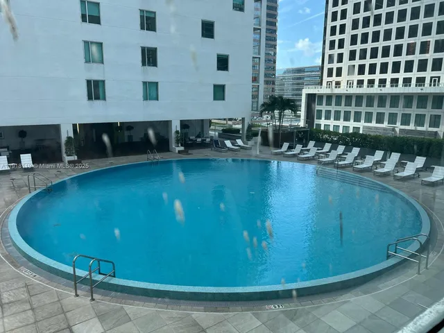 a bed room with a bed and a window