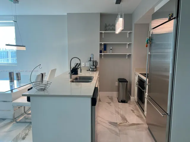 a bedroom with a bed and painting on the wall