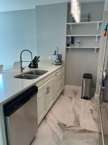 a bedroom with two beds and a window