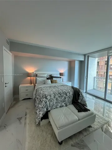 a bathroom with a granite countertop sink a toilet and a mirror