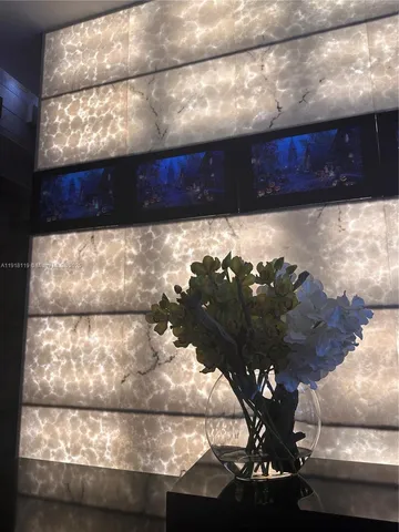 a view of a vase of flowers sitting on a table