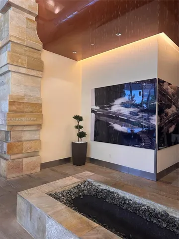 a bedroom with a bed and cabinets