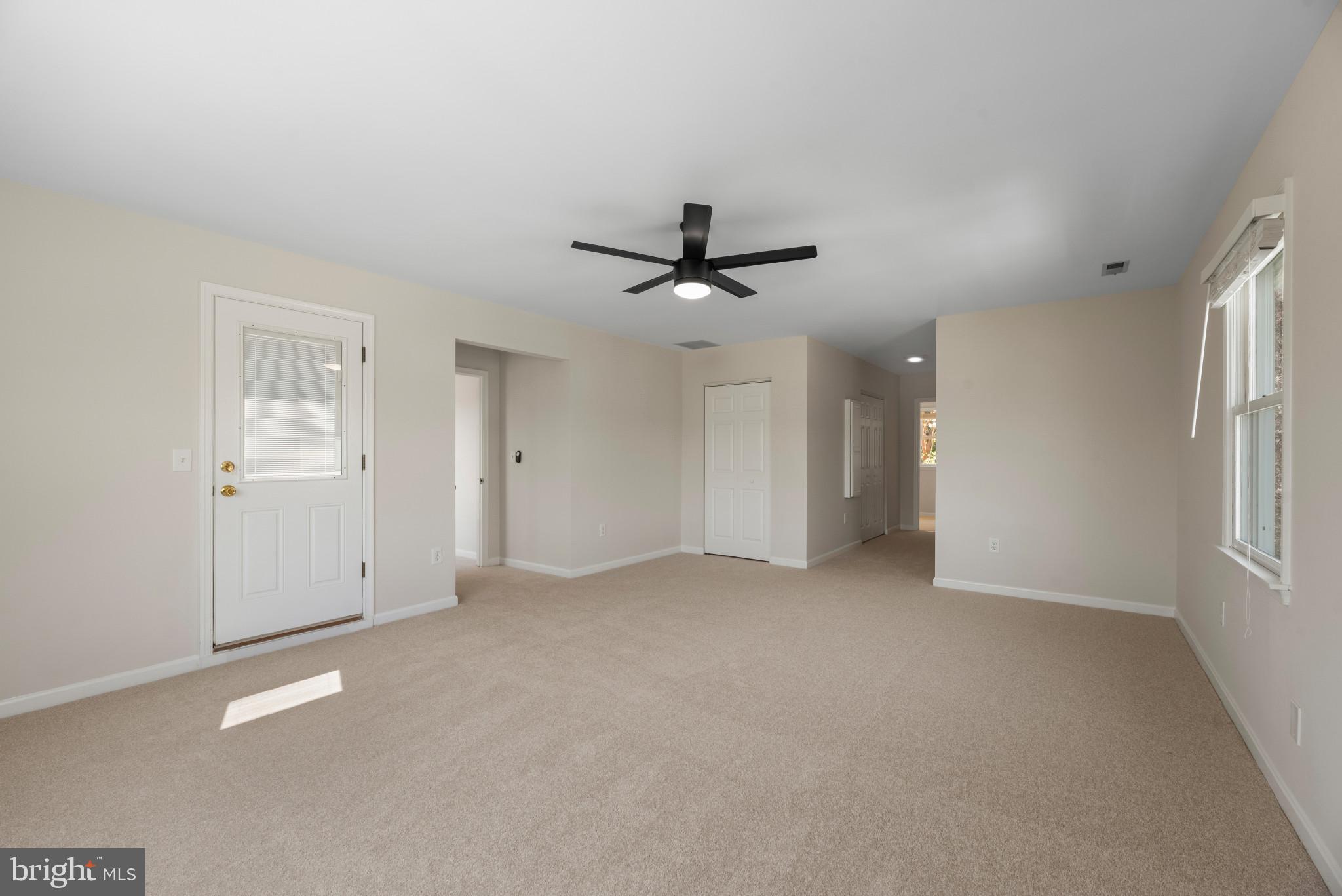5929 Deale Beach Road Deale, MD 20751 - Photo 31 of 58 Unfurnished living room featuring light colored ca