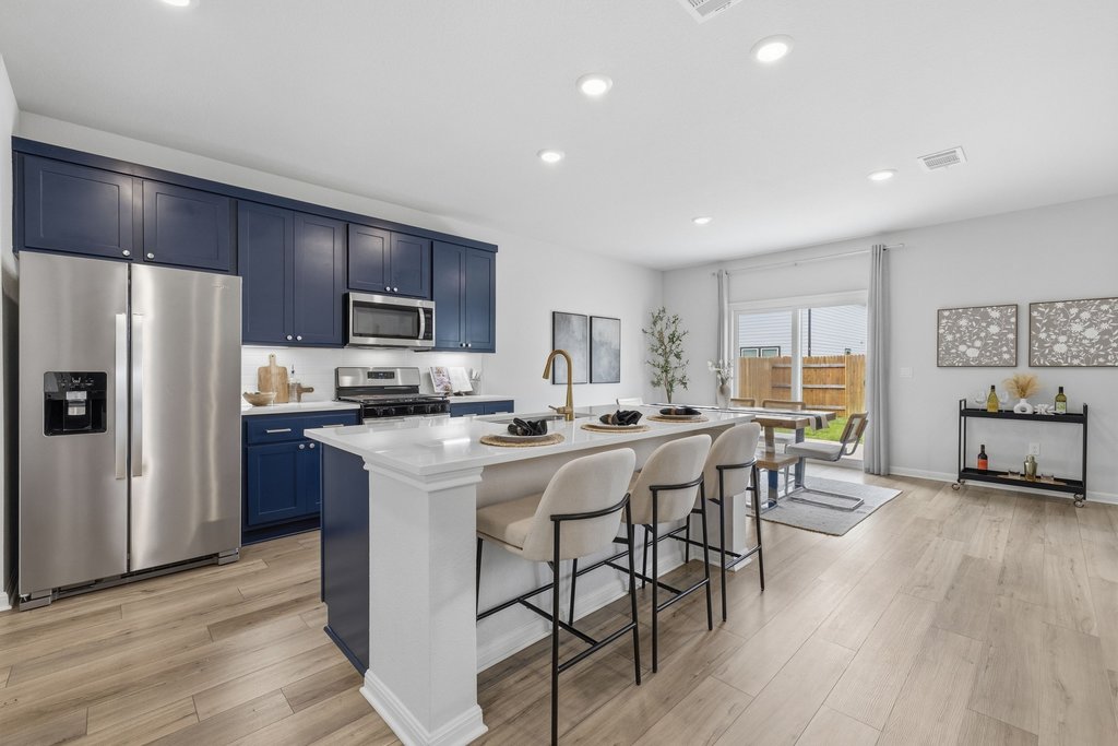 8001 Andravida Drive Austin, TX 78747 - Photo 10 of 35 Designer kitchen with expansive island and effortless entertaining flow