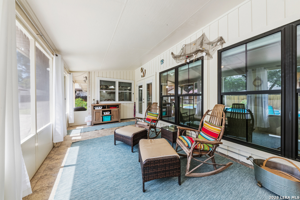 6022 Winding Ridge Drive Windcrest, TX 78239 - Photo 26 of 31 a living room with furniture and floor to ceiling window