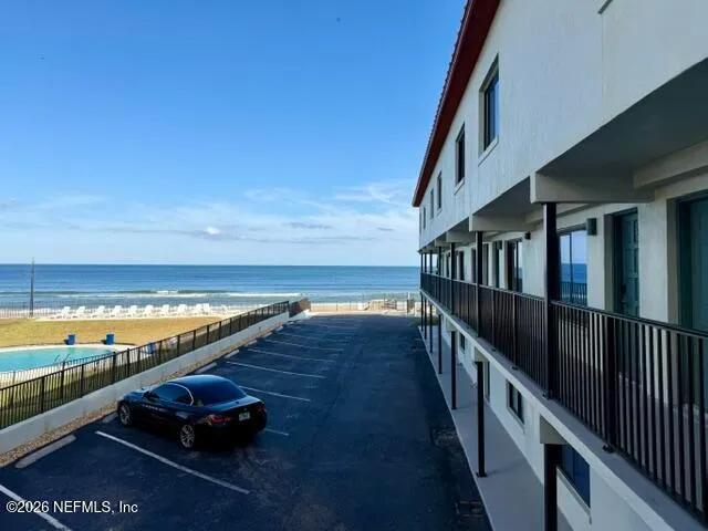a view of swimming pool with an ocean view
