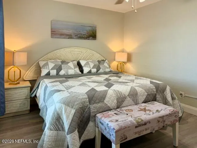 a bedroom with a bed and lamp