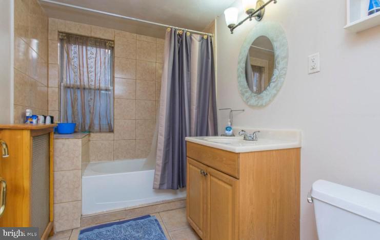 125 Heather Road Upper Darby, PA 19082 - Photo 14 of 15 a bathroom with a sink a toilet and a mirror