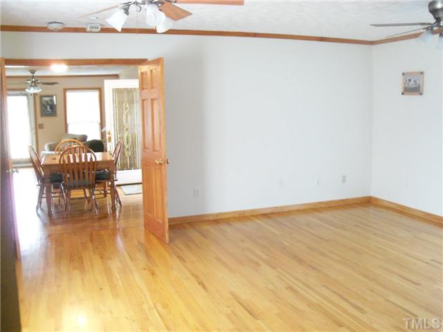 1524 Mill Hill Road Roxboro, NC 27574 - Photo 6 of 16 Family room is located off the kitchen area. Previous owner used this room for the MBR since it has a full bath in it