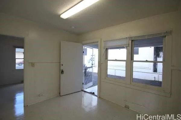 a view of an empty room and window