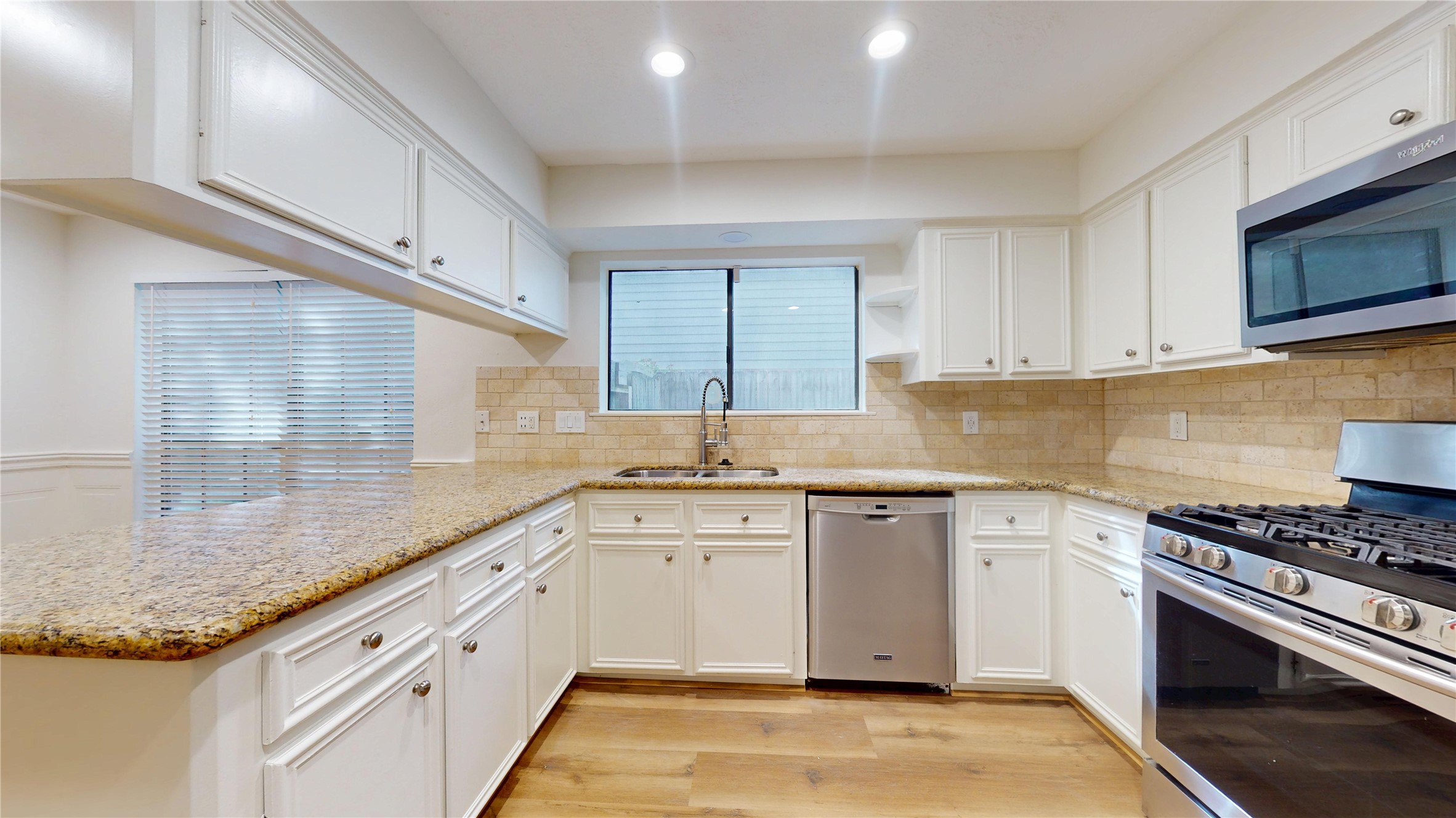 16418 Rainbow Lake Road Houston, TX 77095 - Photo 11 of 47 Spacious kitchen featuring ample cabinetry, counter space, and a large breakfast bar.