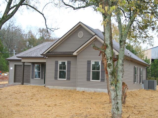 445 Holly Grove Road Lewisburg, TN 37091 - Photo 3 of 3 Special ordered upgrade outside vinyl, water proof laminate floors thru out