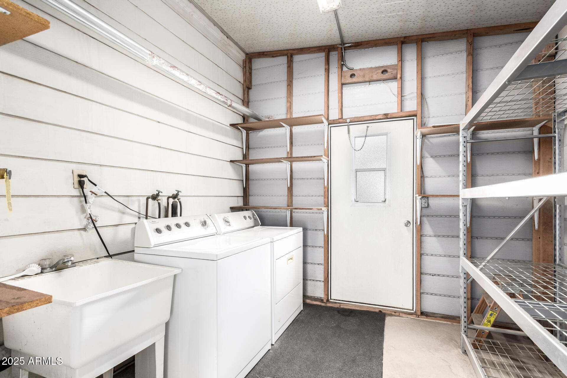 2050 West Dunlap Avenue, Unit R434 Phoenix, AZ 85021 - Photo 22 of 26 a utility room with dryer and washer