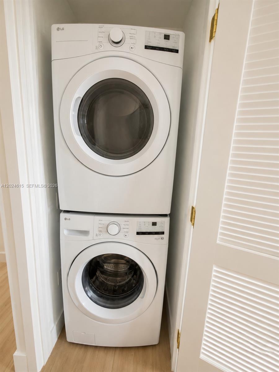90 Northeast 32nd Street, Unit 301 Miami, FL 33127 - Photo 7 of 21 a utility room with dryer and washer