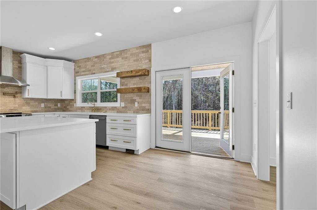 88 Carolyn Path Rockmart, GA 30153 - Photo 12 of 73 a kitchen with window wooden floor and white cabinets
