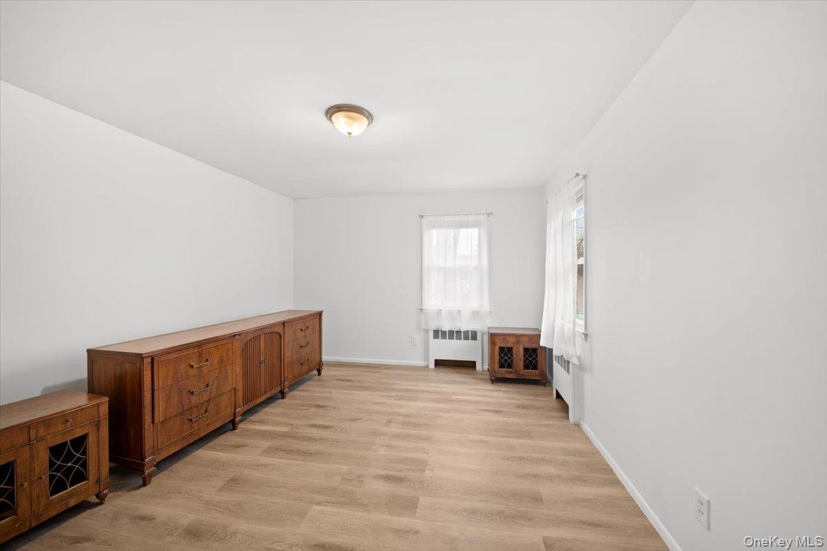 5824 Fieldston Road Bronx, NY 10471 - Photo 12 of 27 a view of a livingroom with wooden floor and furniture