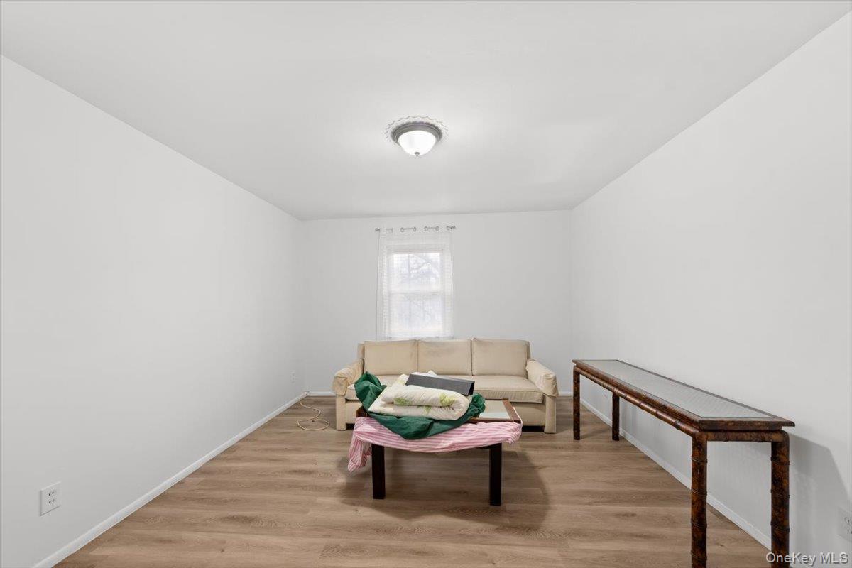 5824 Fieldston Road Bronx, NY 10471 - Photo 14 of 27 a living room with furniture and a window