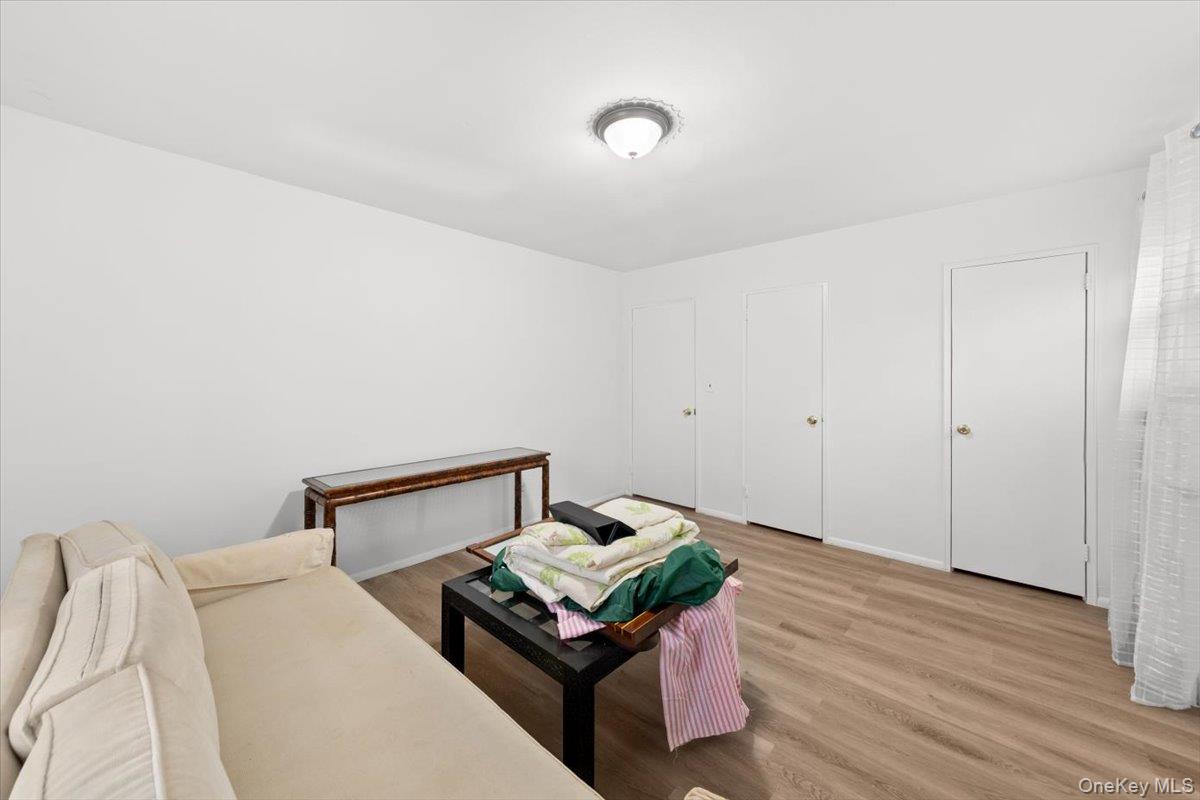 5824 Fieldston Road Bronx, NY 10471 - Photo 15 of 27 a bedroom with a bed and wooden floor