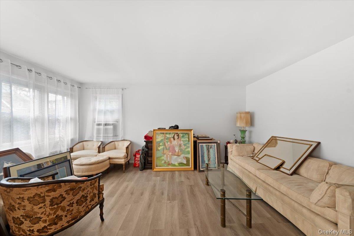 5824 Fieldston Road Bronx, NY 10471 - Photo 7 of 27 a living room with furniture and a wooden floor