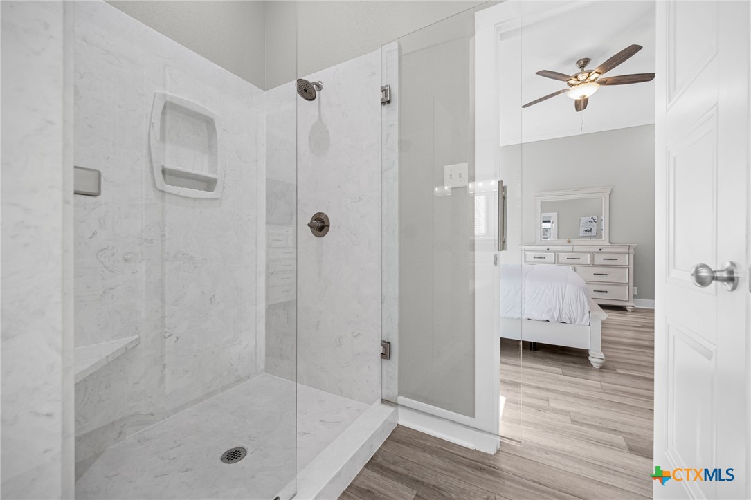 28099 Fm 2670 Killeen, TX 76549 - Photo 16 of 48 a bathroom with a glass shower door