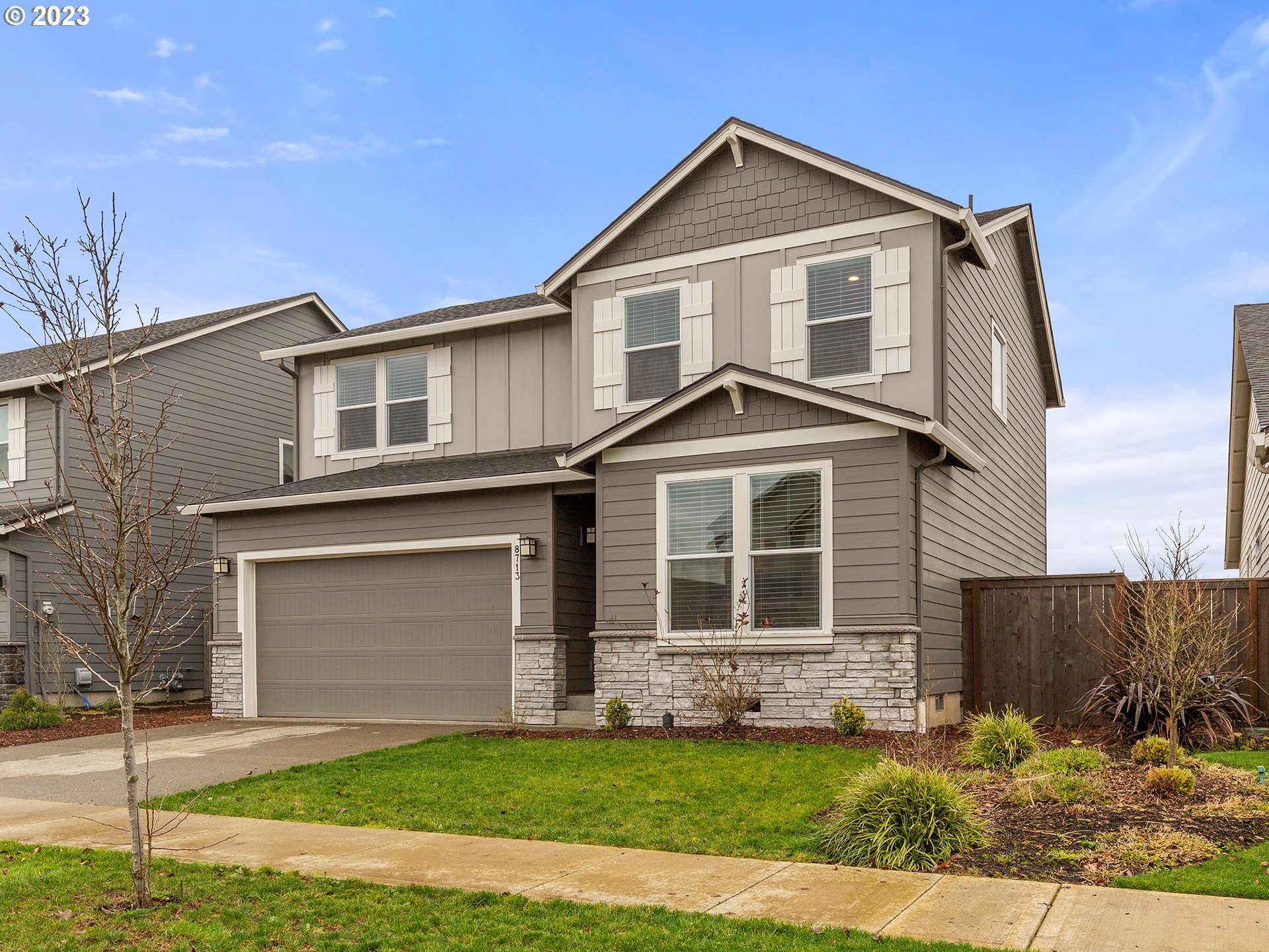 8713 North 1st Street Ridgefield, WA 98642 - Photo 1 of 24 a front view of a house with a yard