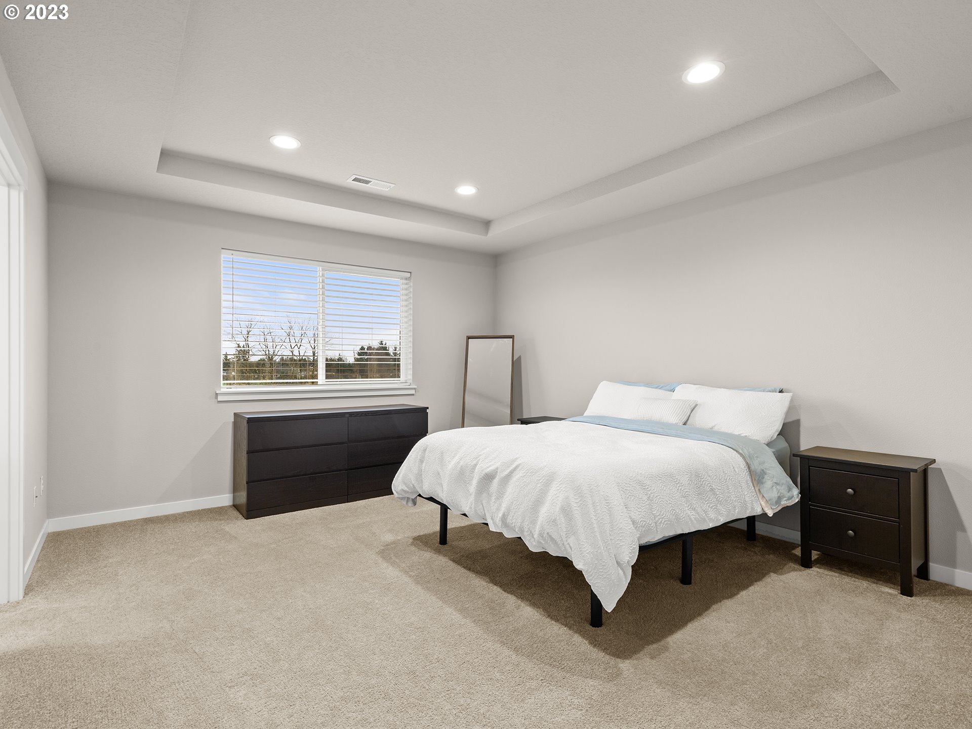 8713 North 1st Street Ridgefield, WA 98642 - Photo 14 of 24 a spacious bedroom with a bed and a dresser