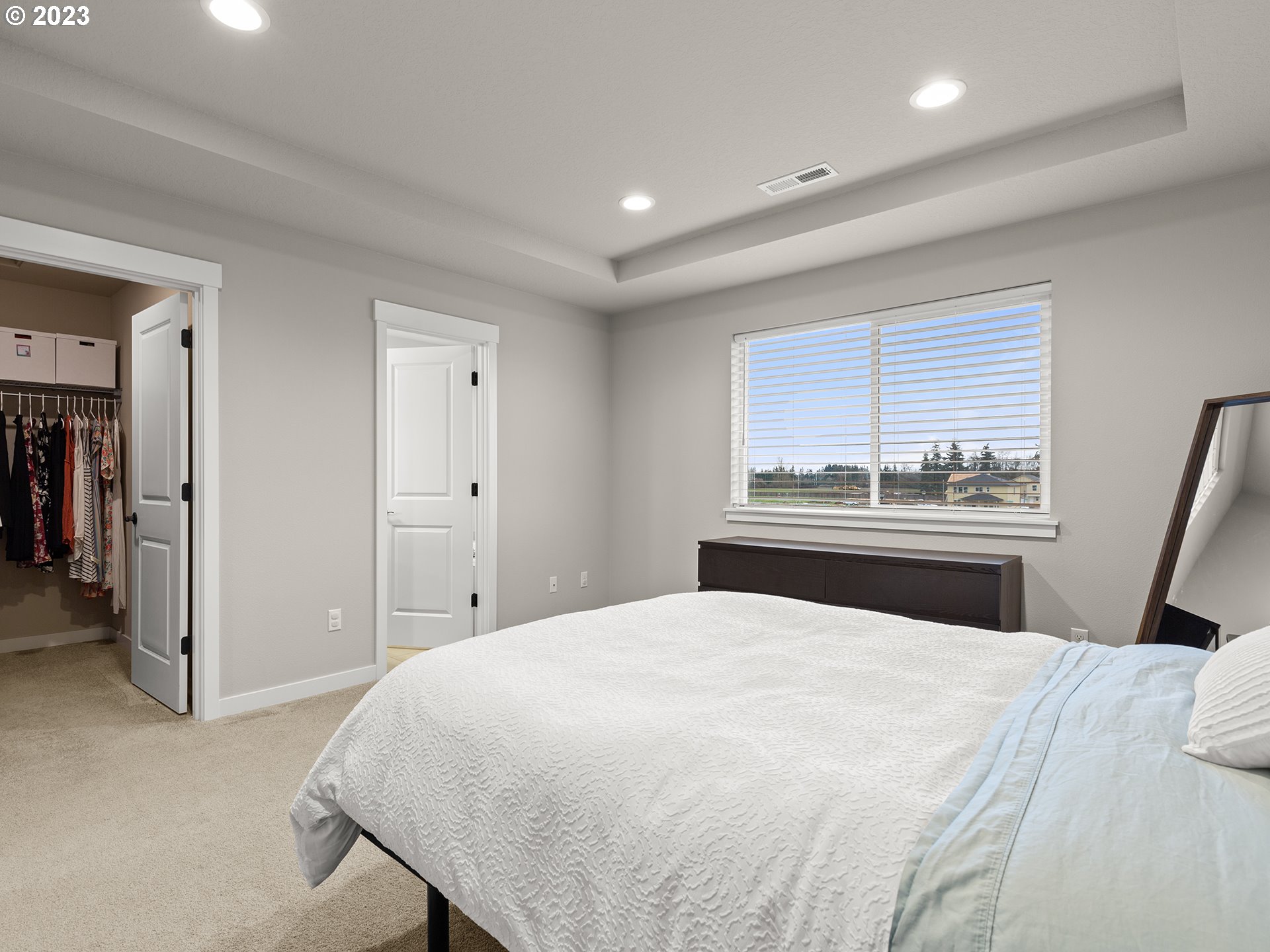 8713 North 1st Street Ridgefield, WA 98642 - Photo 15 of 24 a bedroom with a bed and a dresser