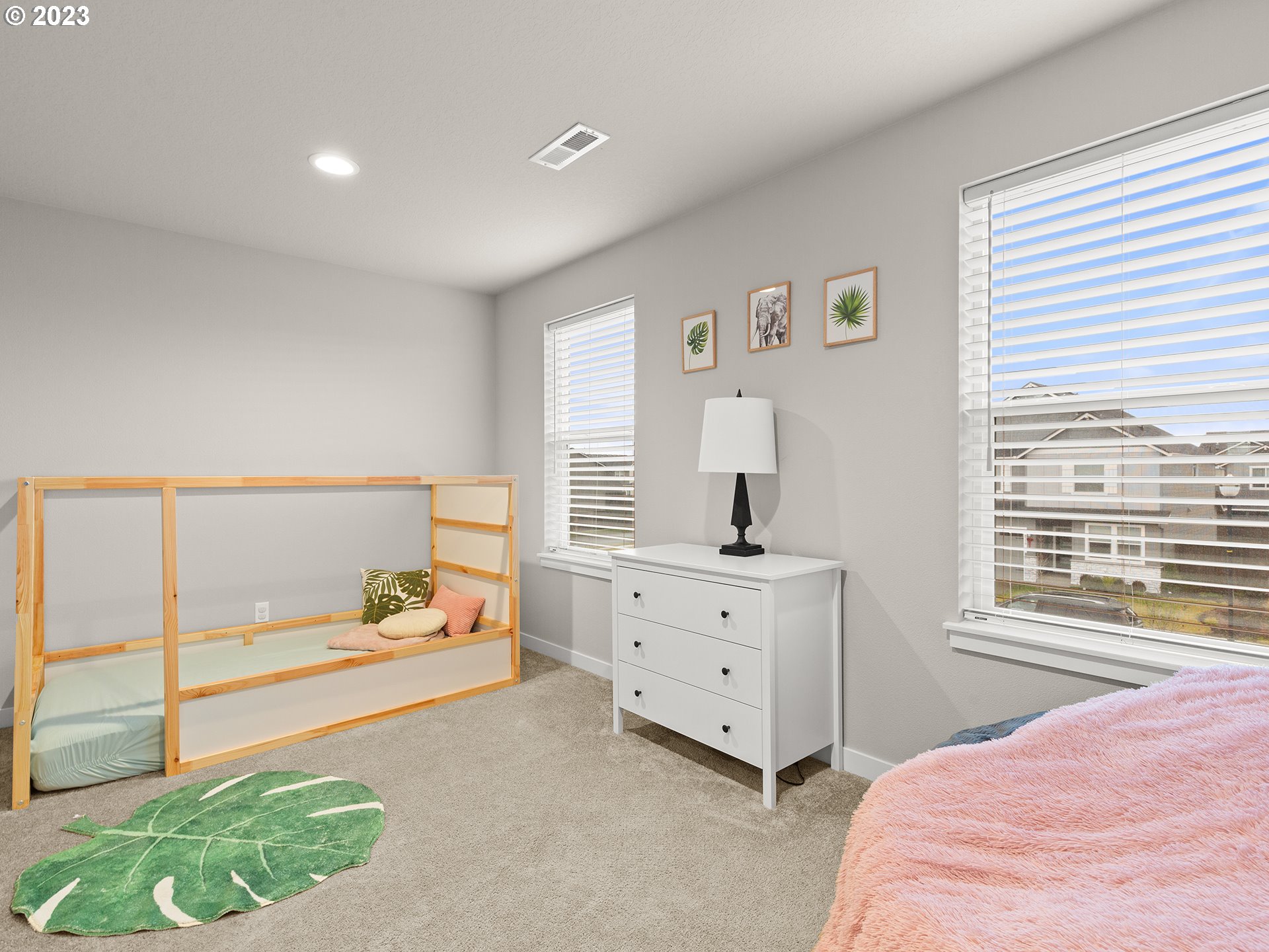 8713 North 1st Street Ridgefield, WA 98642 - Photo 18 of 24 a bedroom with a bed and a window