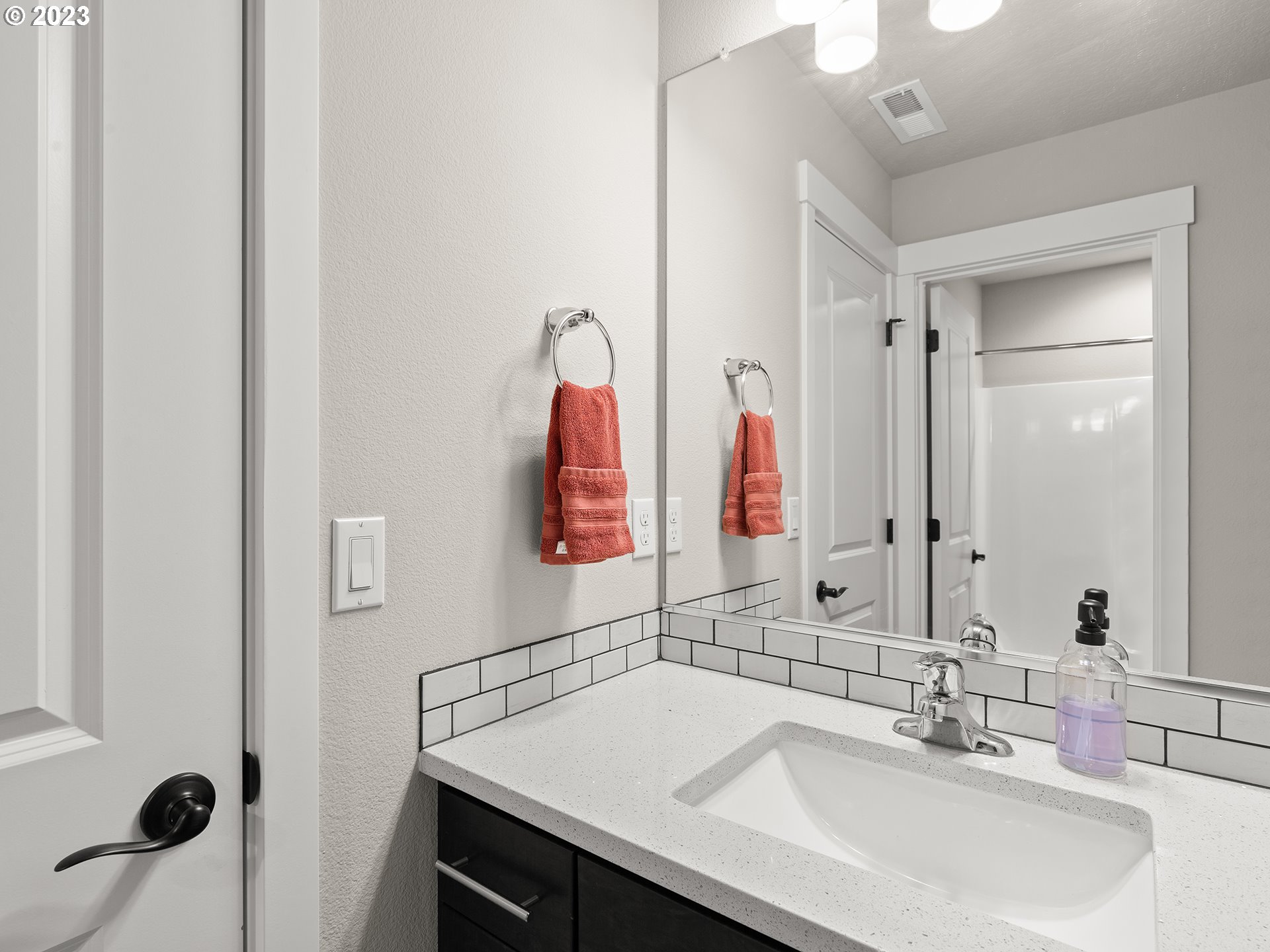 8713 North 1st Street Ridgefield, WA 98642 - Photo 20 of 24 a bathroom with a sink and a mirror