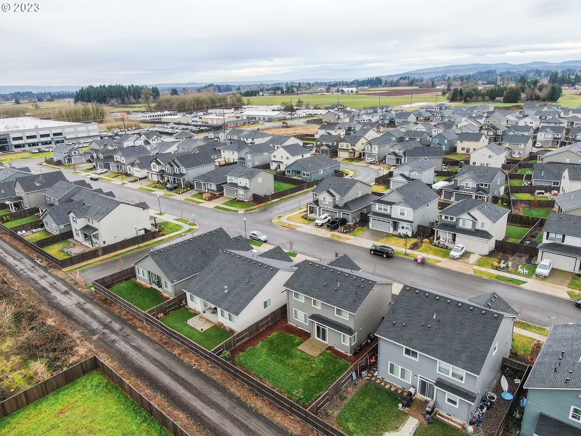 8713 North 1st Street Ridgefield, WA 98642 - Photo 24 of 24 an aerial view of a city with lots of residential buildings and ocean view in back