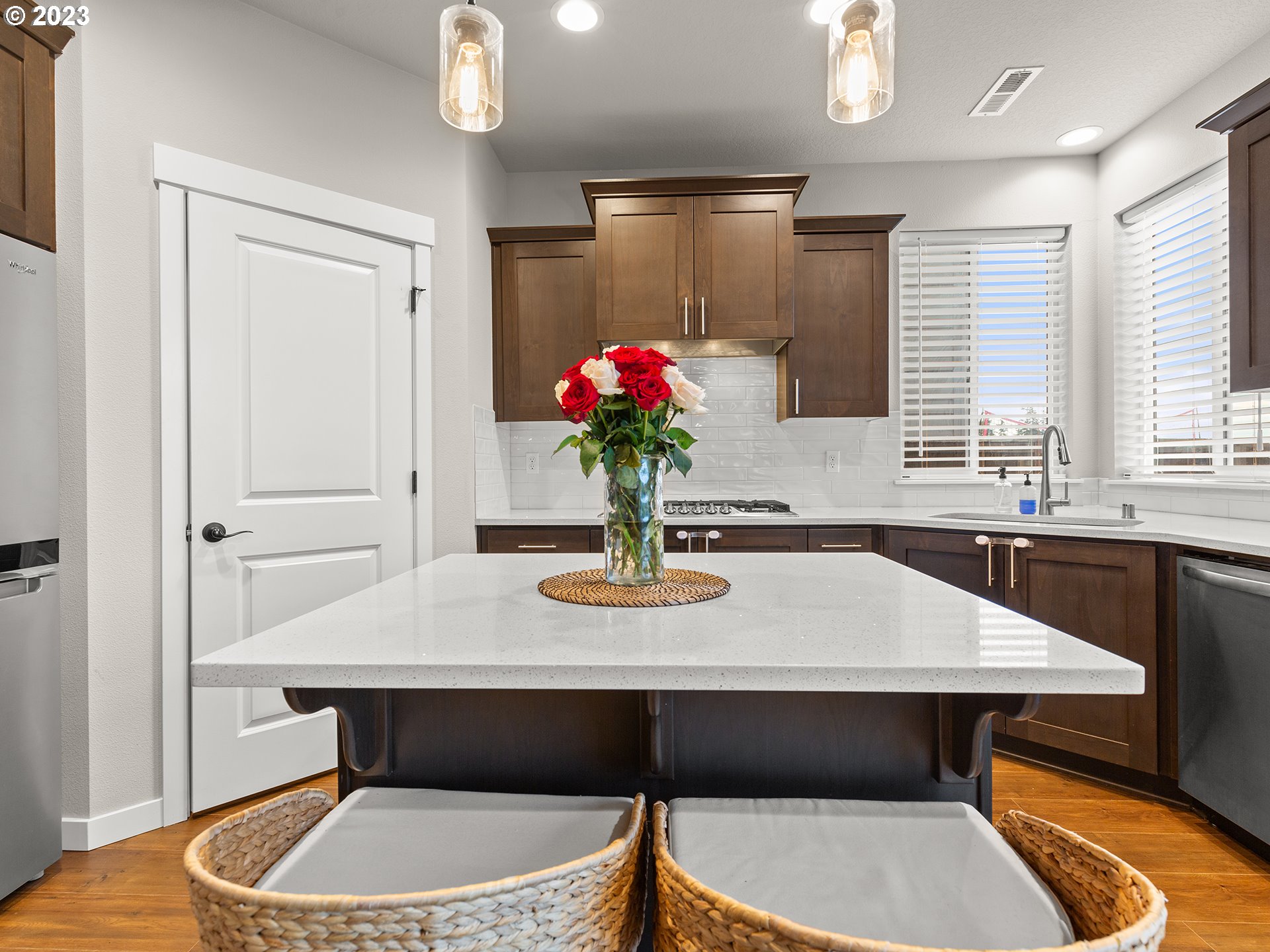 8713 North 1st Street Ridgefield, WA 98642 - Photo 4 of 24 a dining room with table chairs and chandelier