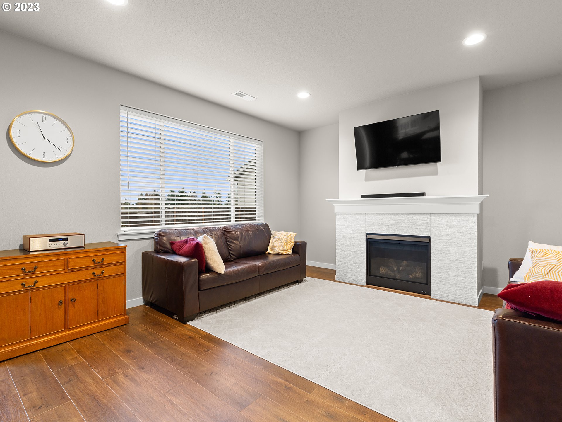 8713 North 1st Street Ridgefield, WA 98642 - Photo 8 of 24 a living room with furniture fireplace and flat screen tv