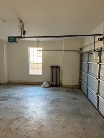 a view of a hallway with wooden shelves