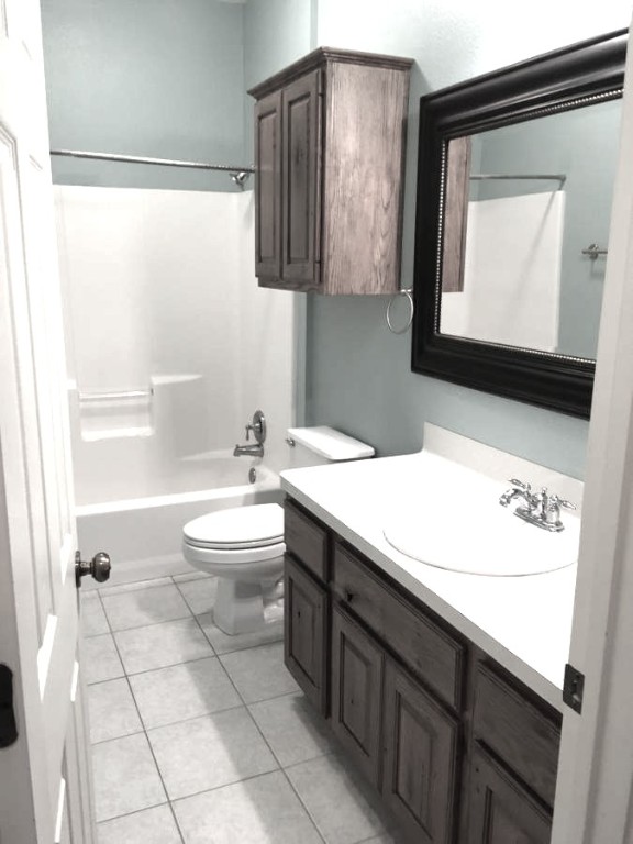 1425 West Villa Maria Road, Unit 306 Bryan, TX 77801 - Photo 15 of 21 a bathroom with a sink a toilet and mirror