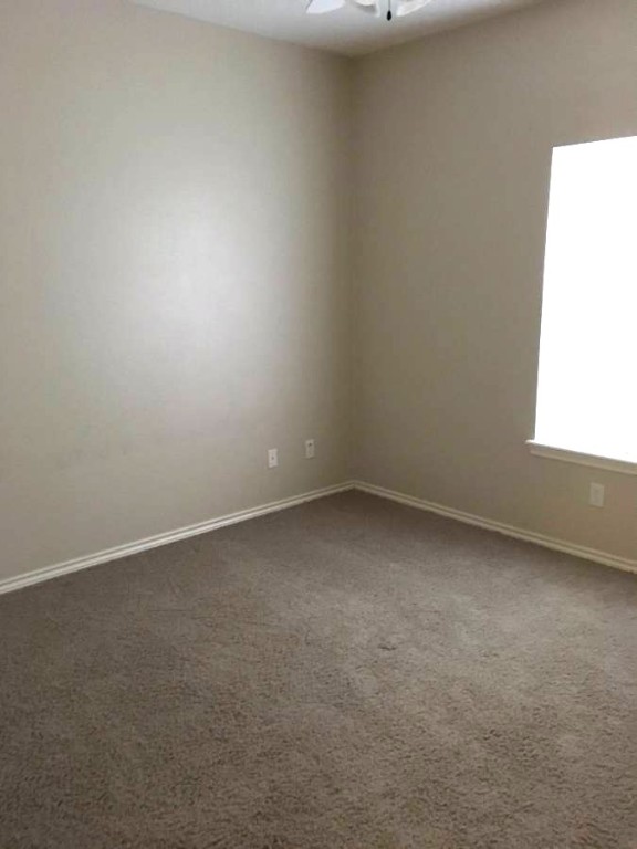 1425 West Villa Maria Road, Unit 306 Bryan, TX 77801 - Photo 17 of 21 a view of an empty room and a window