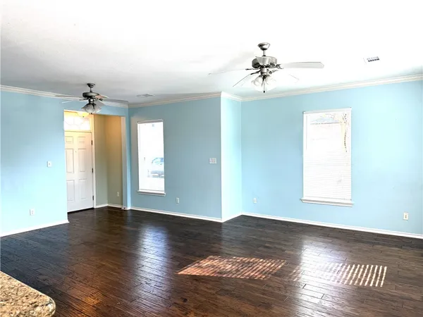 a kitchen with a refrigerator and a sink